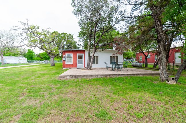 Back of property with a patio, fence, and a lawn | Image 7