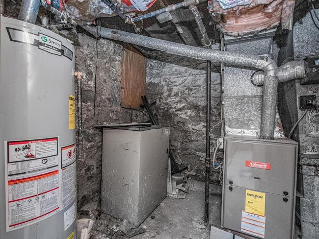 Utilities featuring gas water heater | Image 21
