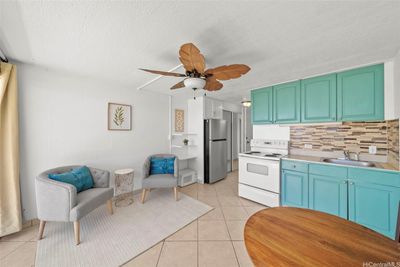 Open dining room, living room, and kitchen, freshly painted, plus new ceiling fan! | Image 3