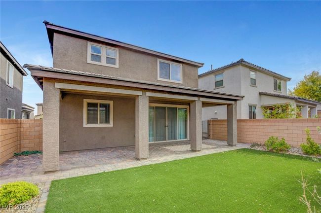 Back of house featuring stucco siding, a patio, and fence | Image 51