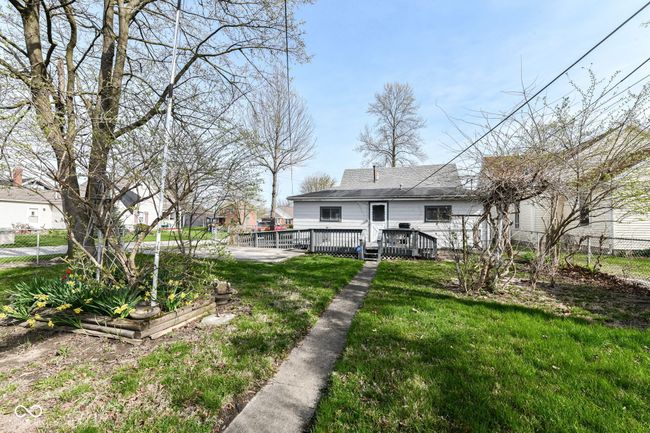 View of yard featuring fence and a wooden deck | Image 27