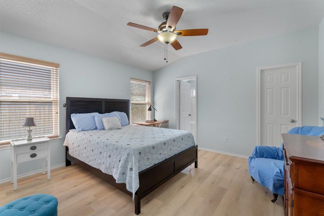 Bedroom featuring light/ceiling fan combination | Image 18
