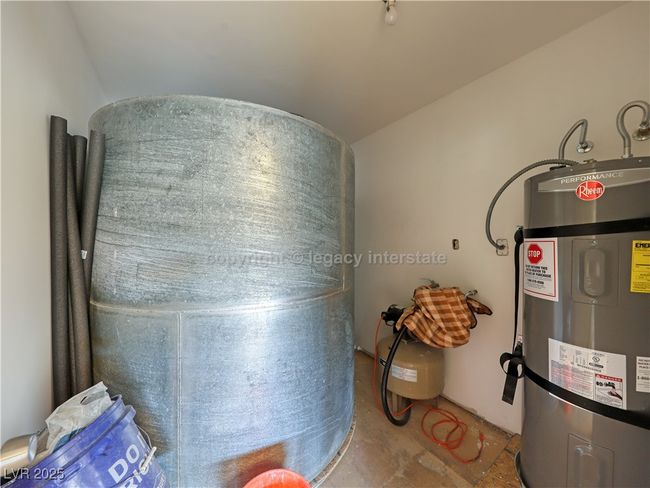 Utility room with secured water heater | Image 37