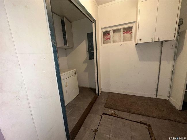 Back porch laundry area with access to crawl space | Image 11