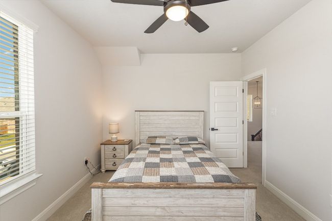 Upstairs 2nd Bedroom with light carpet, and a ceiling fan | Image 17