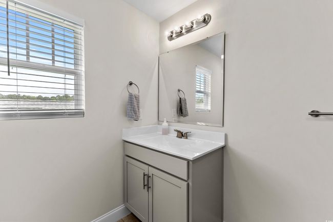 Bathroom featuring healthy amount of natural light, vanity, and baseboards | Image 20