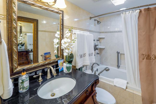 Full bath featuring toilet, tiled shower / bath combo, and vanity | Image 28