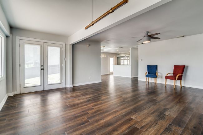 Second living area looking towards the kitchen and breakfast area. | Image 10