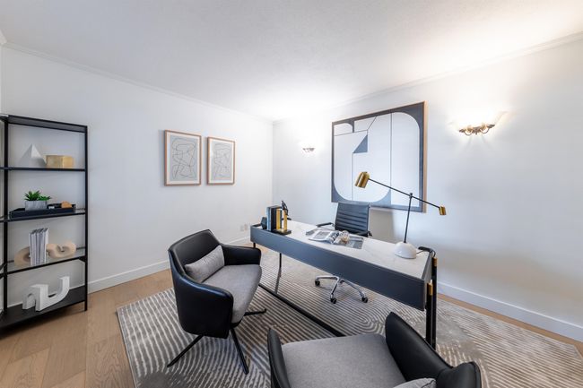 Home office with light wood-style flooring, crown molding, and baseboards | Image 5