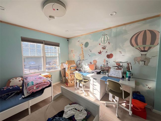 Office space with ornamental molding, wood finished floors, and baseboards | Image 8