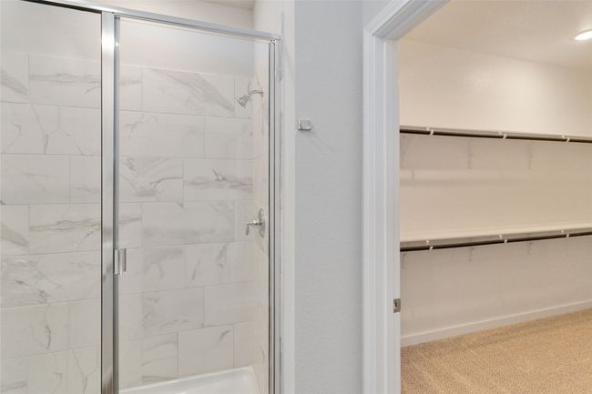 Full bathroom with a spacious closet and a stall shower | Image 32