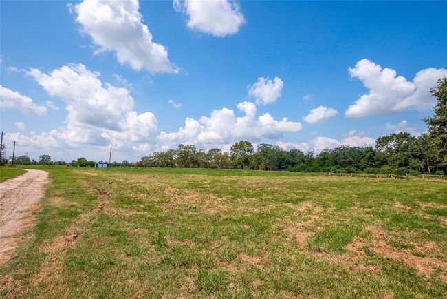 A ground-up look at the lot showcases just how much land there is to work with—flat, cleared, and full of possibility beneath an endless Texas sky. | Image 39
