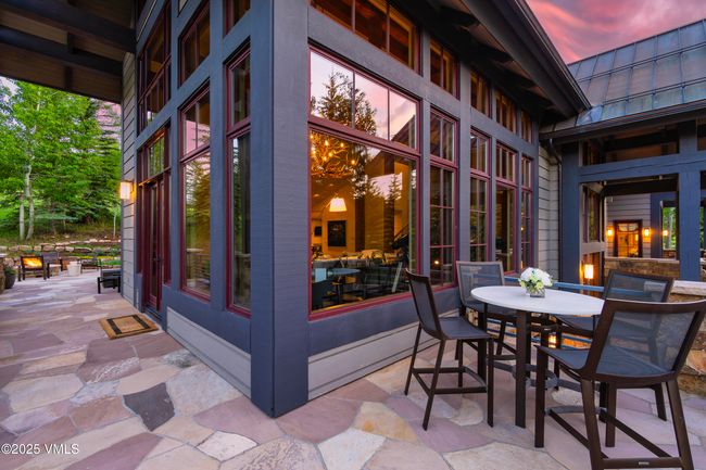 Multi-Sided Flagstone Patio with Panoramic Outdoor Space and a Built-In Gas Fire Pit. | Image 52
