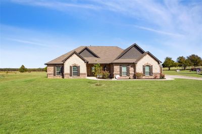 Craftsman-style house with a front lawn | Image 2