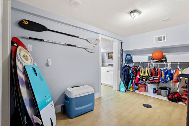 Bedroom currently utlized as a wet room for convenient storage of all your water fun must haves. | Image 20