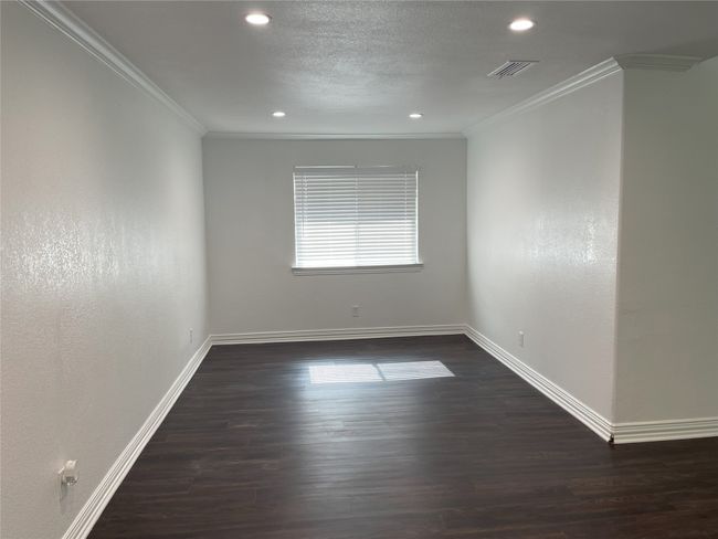 Unfurnished room with ornamental molding, dark wood-style flooring, and recessed lighting | Image 8