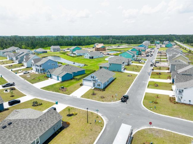 Aerial view of residential area featuring a nearby body of water | Image 4