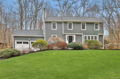 View of front of property featuring a front lawn | Image 1