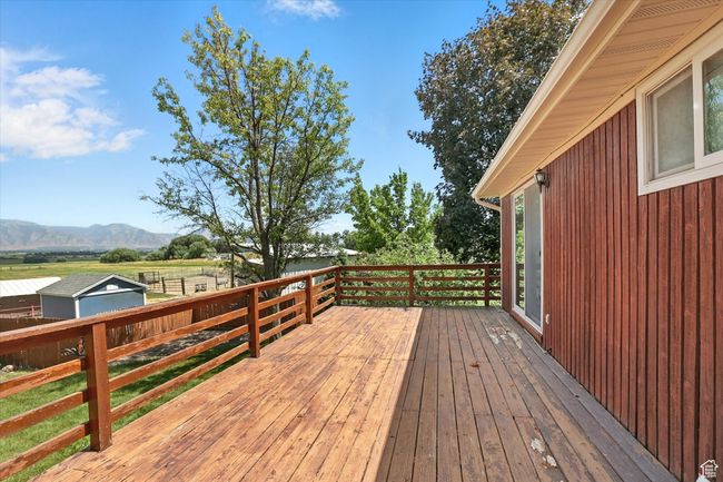 Wooden deck featuring a mountain view | Image 27