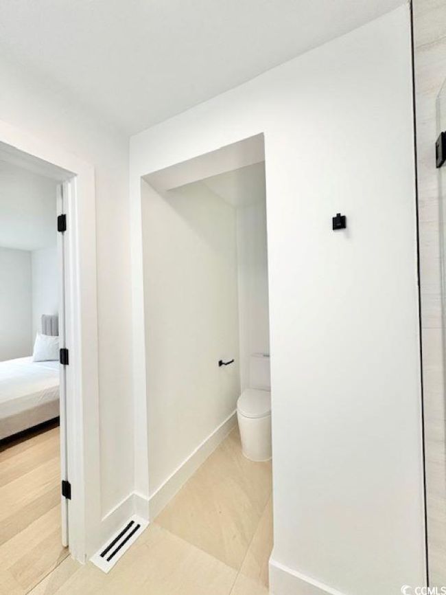 Ensuite bathroom with toilet and a shower | Image 30