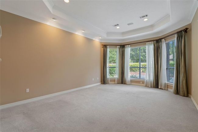 Primary bedroom overlooks the back yard. | Image 19