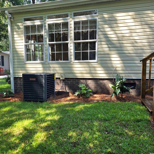 View of property exterior with a yard and crawl space | Image 35