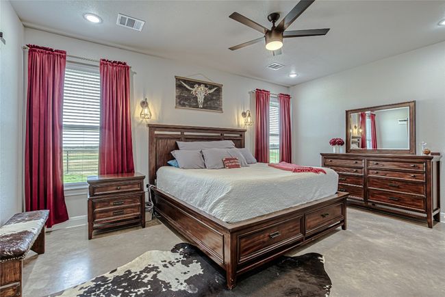 Spacious primary bedroom with ceiling fan | Image 21