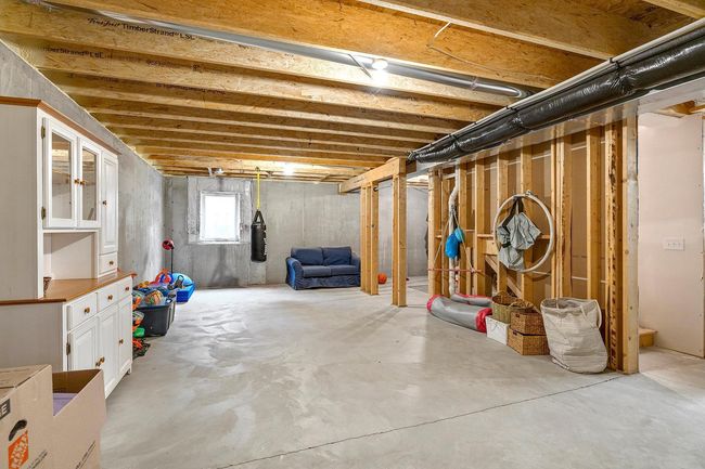 The unfinished lower level is ready for expansion with roughed-in 4th bath and egress window already in place. | Image 36