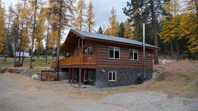 View of side of property with a wooden deck | Image 2