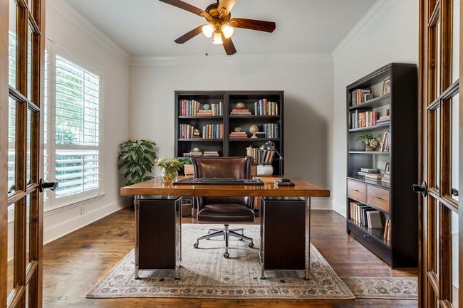 Office featuring baseboards, ornamental molding, dark wood-style floors, and ceiling fan | Image 7