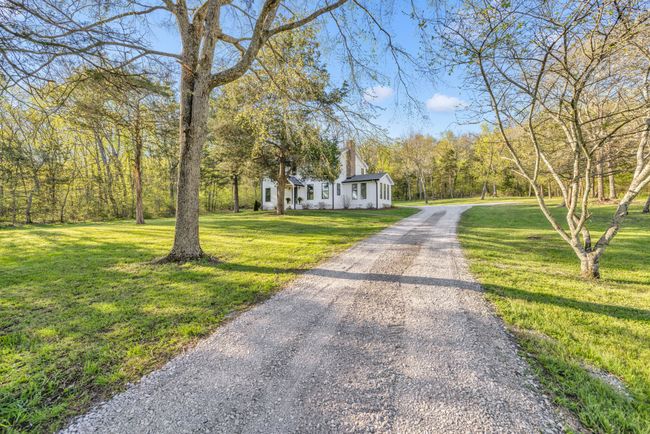 Nice new gravel driveway leading to the home. | Image 44