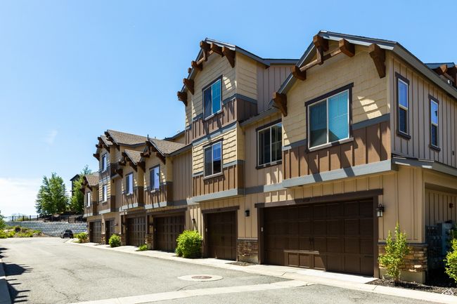 View of building exterior with an attached garage | Image 23
