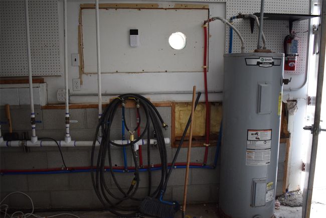 Utility room with propane water heater | Image 86