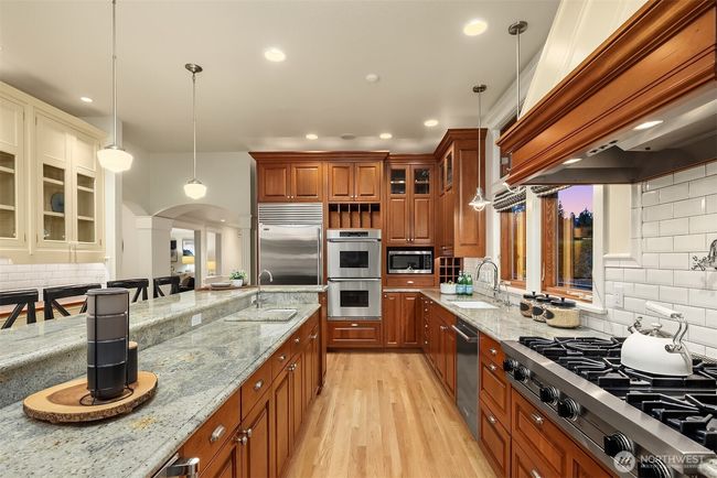 Double Dacor ovens, a subzero fridge and an undercounter wine fridge are a few features offered in this state of the art epicurean's dream kitchen. | Image 11