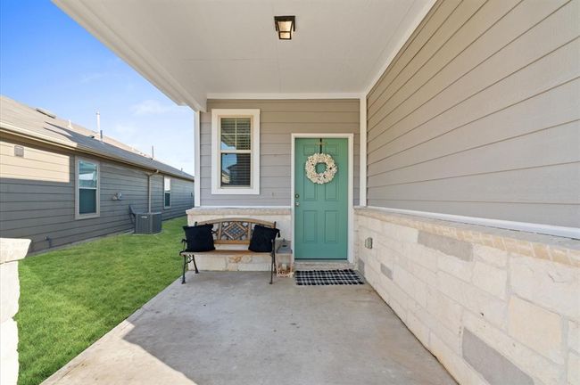 Cozy elevation offers front porch. | Image 4