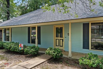 This southern porch is perfect for relaxing and socializing. Bring some Rocking Chairs. | Image 2