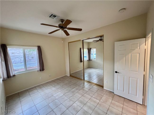 Full bathroom with vanity, a shower stall, toilet, and visible vents | Image 23