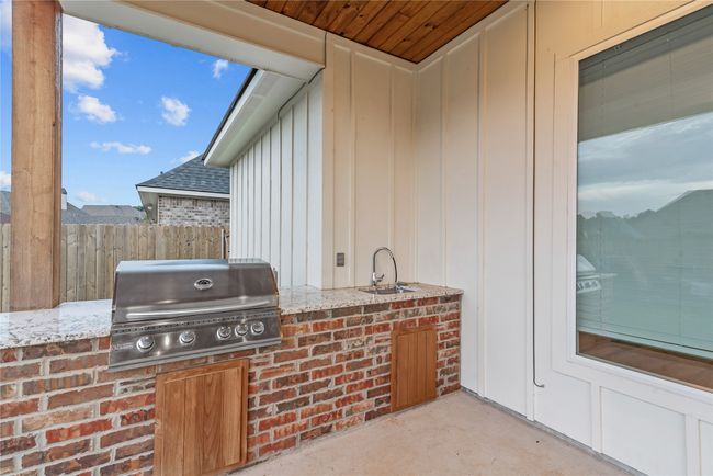 View of patio / terrace with area for grilling and a sink | Image 23