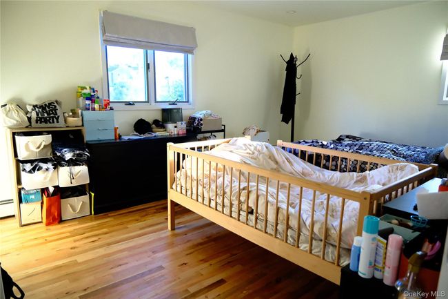 Bedroom featuring light wood-style floors | Image 17