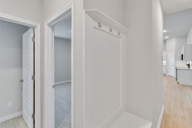 Mudroom with light wood-style floors and baseboards | Image 20