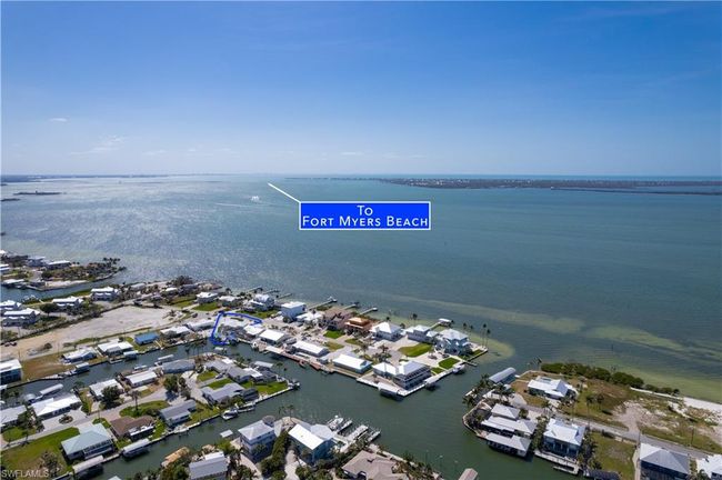 Drone / aerial view featuring a residential view and a water view of the Southern part of Pine Island and Sanibel across the bay and Fort Myers Beach to the South East | Image 34