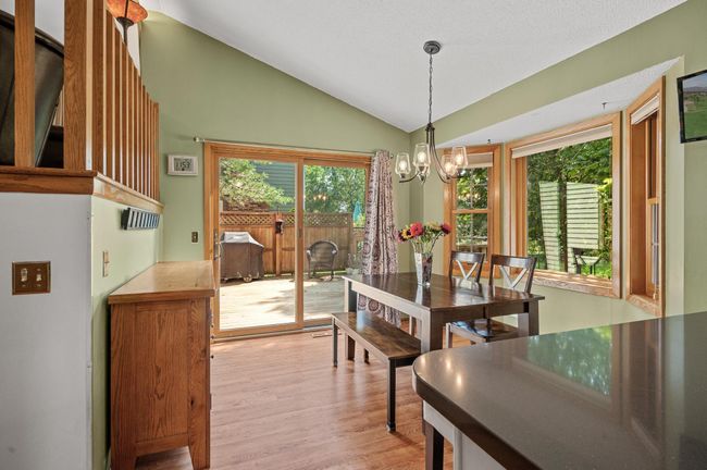 Easily walk out from the dining area to the spacious deck and your huge backyard as an extension of living space. | Image 11