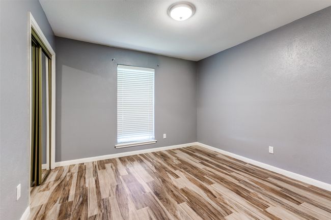 Unfurnished room featuring wood finished floors and baseboards | Image 15