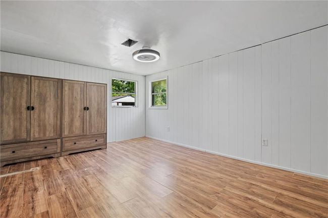 Unfurnished bedroom featuring light wood-style floors | Image 20