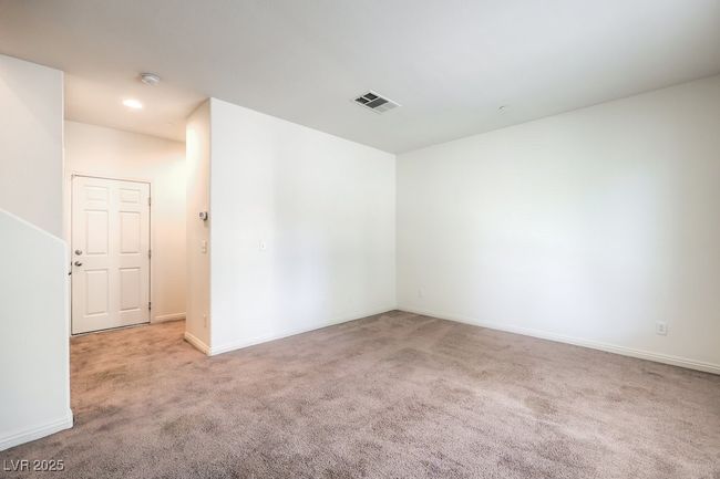 Empty room with baseboards, visible vents, and carpet flooring | Image 13