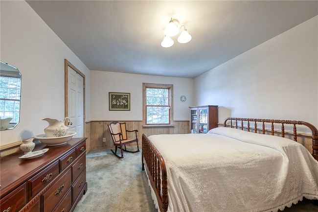 Roomy primary bedroom with a generously sized closet | Image 18