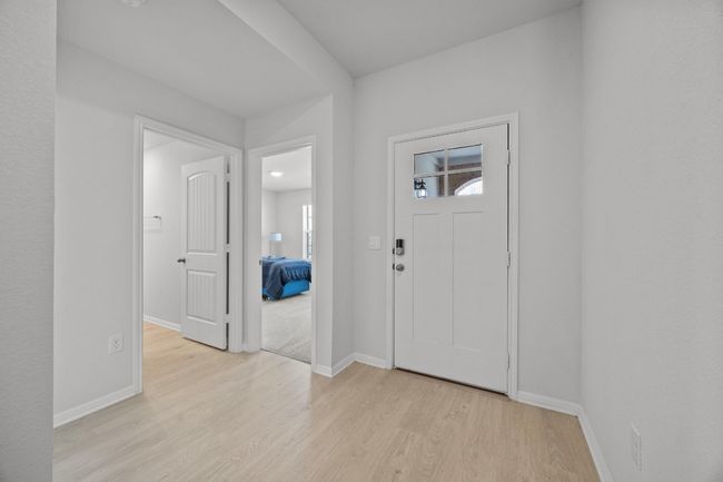 Foyer entrance with baseboards and light wood-look floors | Image 5