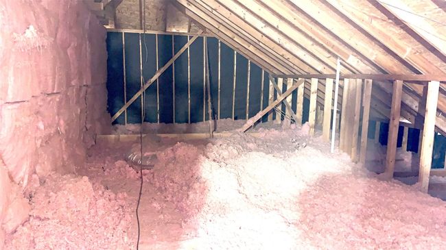 View of expanded walk-out attic storage space to the rear of the upper level. | Image 20