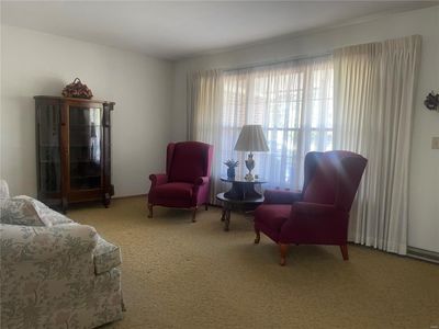 Sitting room featuring carpet floors | Image 2