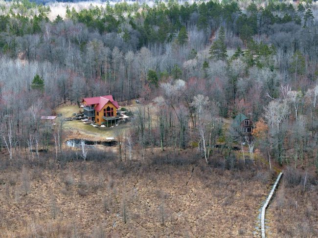 Here you can see the location of both the main cabin and guest cabin along with the boardwalk to the lake. | Image 9